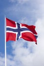 Wavy Norwegian flag against blue sky