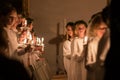 Vaxjo, Sweden - December, 2017: The swedish tradition of Lucia is celebrated in Vaxjo church with song, candles and white gowns
