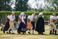 Vaxjo, Sweden, June 2023: People gathered around Maypole during Swedish Midsommar festival in traditional dressing