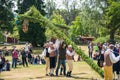 Vaxjo, Sweden, June 2023: People gathered around Maypole during Swedish Midsommar festival in traditional dressing