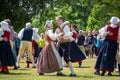 Vaxjo, Sweden, June 2023: People gathered around Maypole during Swedish Midsommar festival in traditional dressing