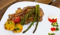 Veal with baked vegetables is tasty dish