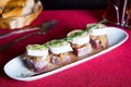 Veal and goat cheese tapa. A small slice of bread on which a small portion of food is placed is called a skewer. Royalty Free Stock Photo