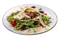 Veal and pear salad with olive-balsamic dressing. Isolated on a white background