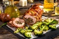 Veal roll rolled with prosciutto and filled with seeds and feta Royalty Free Stock Photo