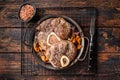 Veal shank stew Osso Buco, italian ossobuco meat steak. Wooden background. Top view