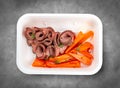 Veal sous vide with juicy carrots. Healthy diet. Takeaway food. Eco packaging. Top view, on a gray background