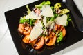 Veal steak salad with arugula, lettuce, tomato, olives and parmesan cheese Royalty Free Stock Photo