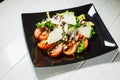 Veal steak salad with arugula, lettuce, tomato, olives and parmesan cheese Royalty Free Stock Photo