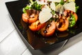 Veal steak salad with arugula, lettuce, tomato, olives and parmesan cheese Royalty Free Stock Photo