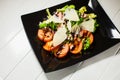 Veal steak salad with arugula, lettuce, tomato, olives and parmesan cheese Royalty Free Stock Photo