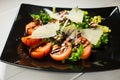 Veal steak salad with arugula, lettuce, tomato, olives and parmesan cheese Royalty Free Stock Photo