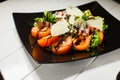 Veal steak salad with arugula, lettuce, tomato, olives and parmesan cheese Royalty Free Stock Photo