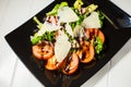 Veal steak salad with arugula, lettuce, tomato, olives and parmesan cheese Royalty Free Stock Photo