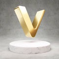 VeChain cryptocurrency icon. Gold 3d rendered icon on white marble podium Royalty Free Stock Photo