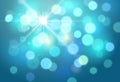 Vector abstract bright blue background with blurred lights and sparkles