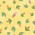 Vector almond seamless pattern background. Assorted clusters of brown oval nuts with leaves on yellow backdrop. Kernel Royalty Free Stock Photo