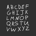 Vector alphabet letters, white chalk written on dark blackboard Royalty Free Stock Photo