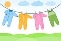 Vector baby clothes on clothesline.