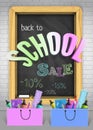 Vector Back to school Sale concept with colorful education elements and blackboard on textured brick wall background. Royalty Free Stock Photo