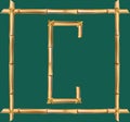 Capital letter C made of realistic brown dry bamboo poles inside of wooden stick frame