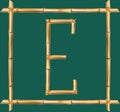 Capital letter E made of realistic brown dry bamboo poles inside of wooden stick frame Royalty Free Stock Photo
