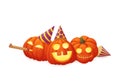 Three happy pumpkins in party hats with party blowout isolated on a white background.