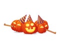 Three happy pumpkins in party hats with party blowouts on a white background. Royalty Free Stock Photo