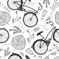 Vector bicycles, florals and leaves hand drawn seamless pattern. Vintage doodle style background. Royalty Free Stock Photo