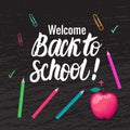Vector card Welcome Back to school . Lettering inscription and school symbols on black chalk board background. Royalty Free Stock Photo
