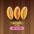 Vector cartoon hotdogs label isolated on wooden table background. Vintage hot dog poster or icon design element Royalty Free Stock Photo