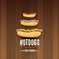 Vector cartoon hotdogs label isolated on wooden table background. Vintage hot dog poster or icon design element Royalty Free Stock Photo