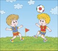 Little football players with a ball Royalty Free Stock Photo