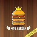 Vector cartoon royal king burger with cheese and golden crown icon isolated on on wooden table background.