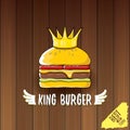 Vector cartoon royal king burger with cheese and golden crown icon isolated on on wooden table background.