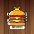 Vector cartoon royal king burger with cheese and golden crown icon on on wooden table background.