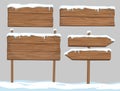 Vector cartoon set of blank wooden signs covered with snow and i Royalty Free Stock Photo