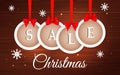 Vector Christmas sale banner with white round frames, red bows and snowflakes on dark brown wooden background Royalty Free Stock Photo