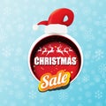 Vector Christmas sales paper banner or tag label with red santa hat on snowy blue background with falling snowflakes Royalty Free Stock Photo