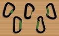 Vector Climbing carabiners set on wooden background