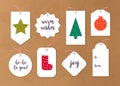 Vector collection of christmas gift tags and badges different shapes isolated on paper background. Royalty Free Stock Photo