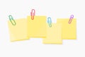 Vector of a colored paperclips with blank yellow notepaper Royalty Free Stock Photo