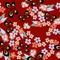 Vector colorful seamless pattern on a saturated red background with small multicolored flowers and stylized butterflies Royalty Free Stock Photo