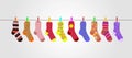 Vector colorful socks on gray background are hanging on rope