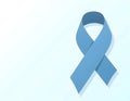 a vector design of a blue ribbon, symbol of diabetes awareness on a gradient blue and white surface Royalty Free Stock Photo