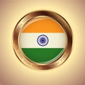 A round gold medal with the Indian flag on it