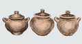 A set of three clay pots