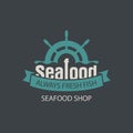 Banner for seafood shop with a ship helm