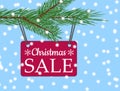 Vector eps 10 christmas sale banner with red poster with white text christmas sale hanging from spruce tree branch Royalty Free Stock Photo