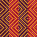 Vector ethnic rhombs texture . Carpet or wallpaper pattern. Red, blue and yellow colors